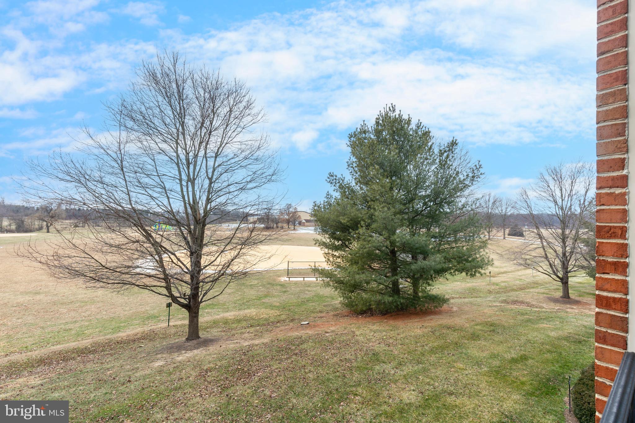 3850 Normandy Drive, Unit 2B Hampstead, MD 21074 - Photo 25 of 26 a view of a yard with a house