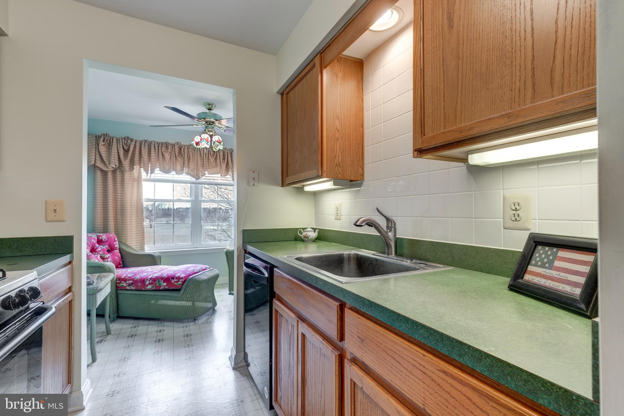 3850 Normandy Drive, Unit 2B Hampstead, MD 21074 - Photo 10 of 26 a kitchen with a sink cabinets and utility