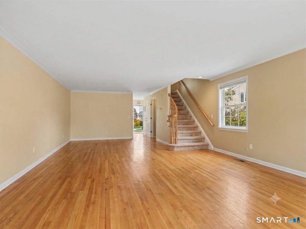 180 Turn Of River Road, Unit 13A Stamford, CT 06905 - Photo 7 of 40 Living Room looking to Dining Room and front Entry