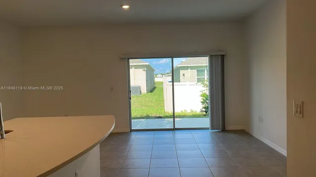 a view of an empty room and window