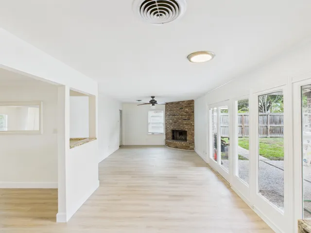 an entryway with wooden floor