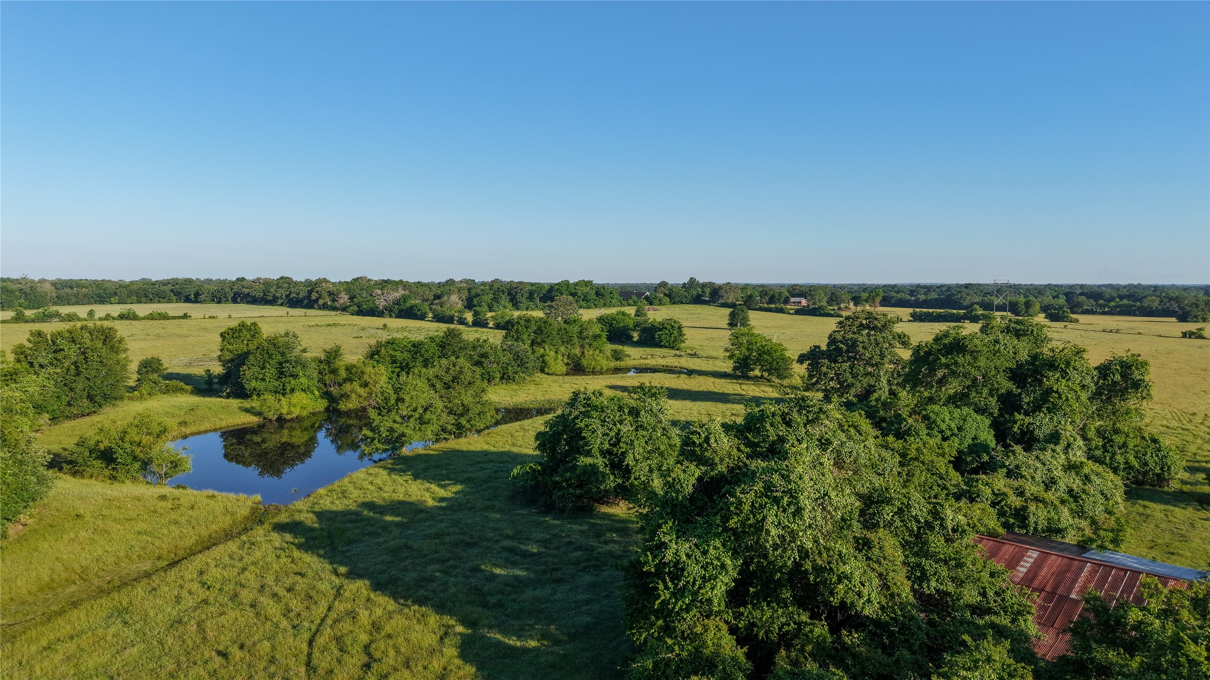 3765 Poteet Road Normangee, TX 77871 - Photo 35 of 37 a view of a lake with a city