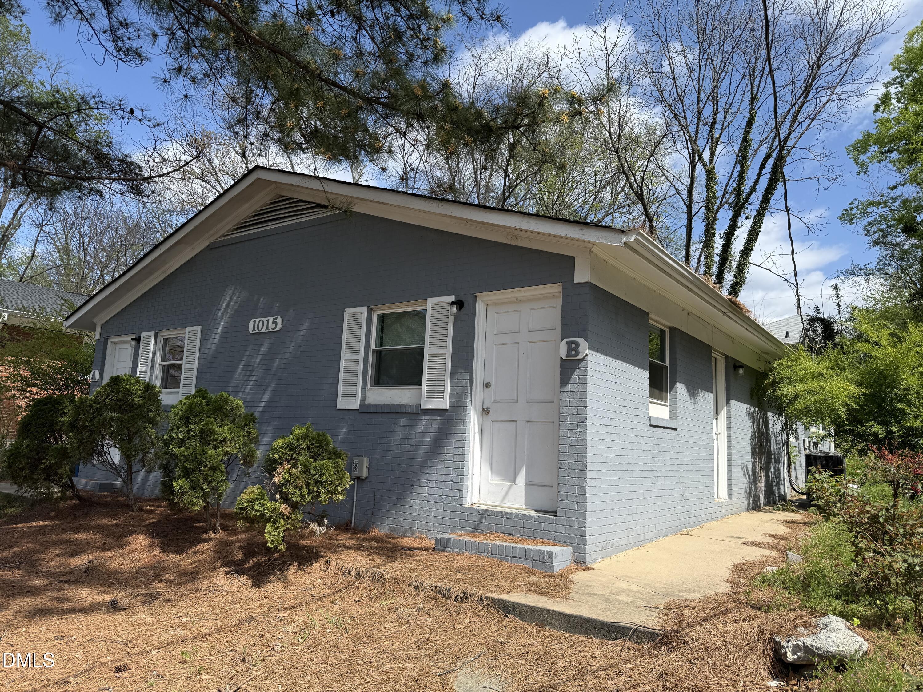 1015 Rosedale Avenue Durham, NC 27707 - Photo 15 of 15 a front view of house with yard and trees around