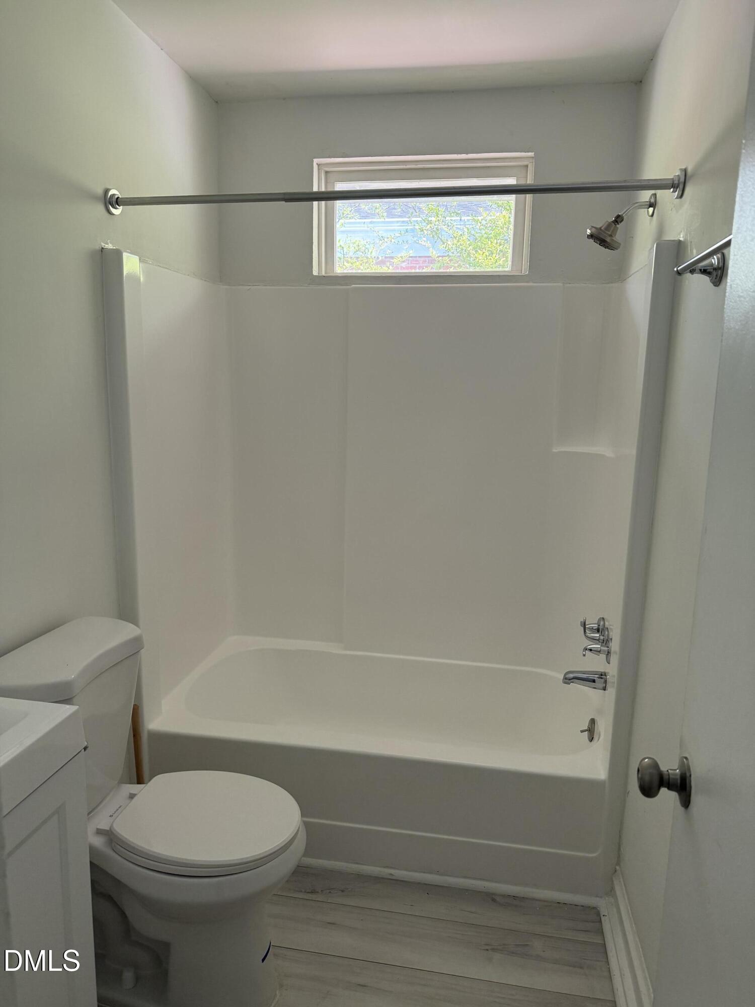 1015 Rosedale Avenue Durham, NC 27707 - Photo 8 of 15 a bathroom with a shower and a toilet