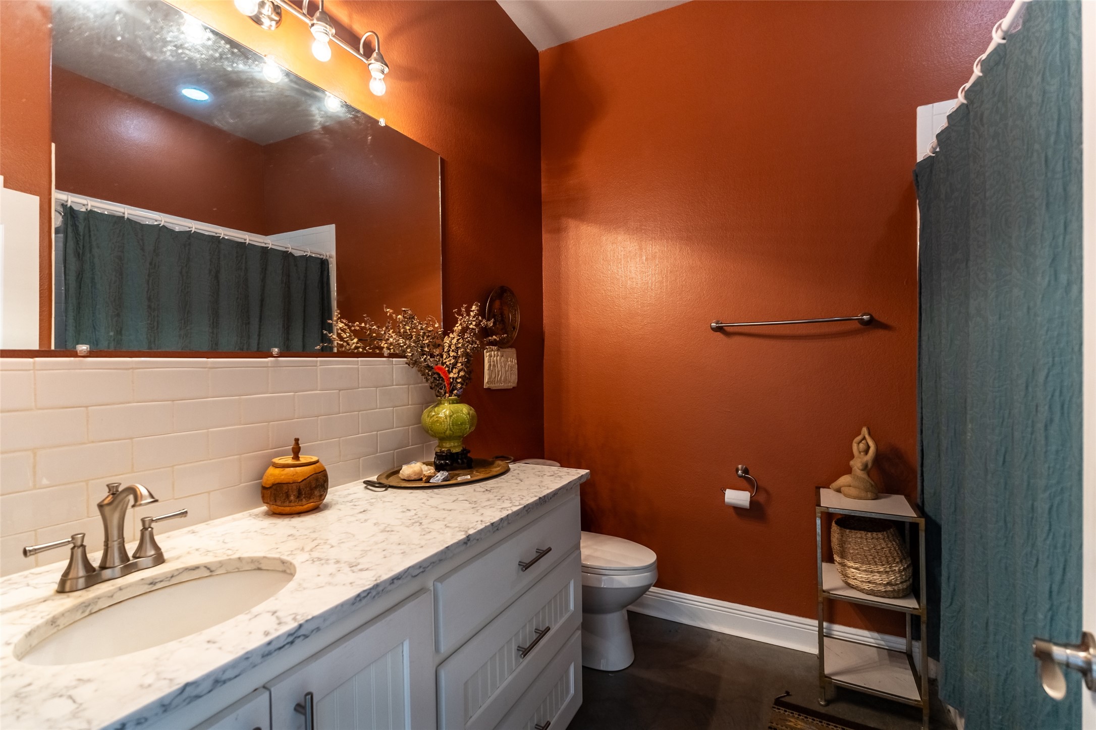 4082 Old Colony Line Road Lockhart, TX 78644 - Photo 11 of 40 A well-appointed bath features a spacious vanity with an undermount sink and a full-width mirror.