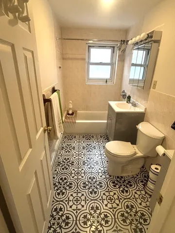 a bathroom with a toilet a sink and a bathtub
