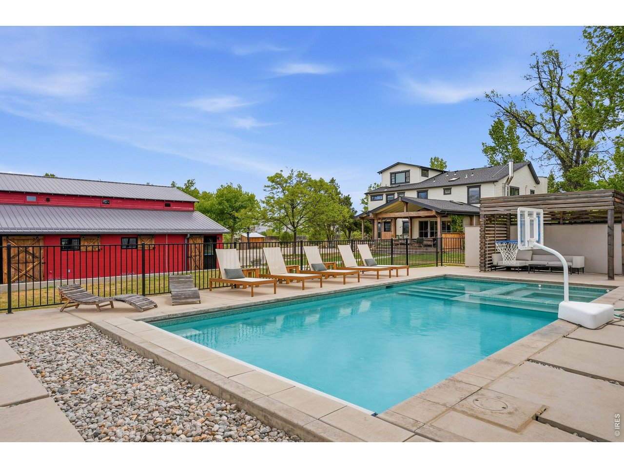 4795 Jay Road Boulder, CO 80301 - Photo 32 of 50 Heated saltwater pool and spa with wi-fi controls, automatic cover, pergola, pool house for mechanicals, fully fenced in.