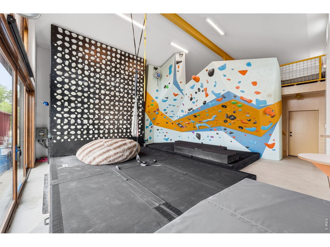4795 Jay Road Boulder, CO 80301 - Photo 38 of 50 Professional-grade climbing wall designed and built by renowned local climbing wall builder, includes Kilter board, auto-belay, ample landing pads, tops out into a guest loft. This space could also easily be converted into an ADU.