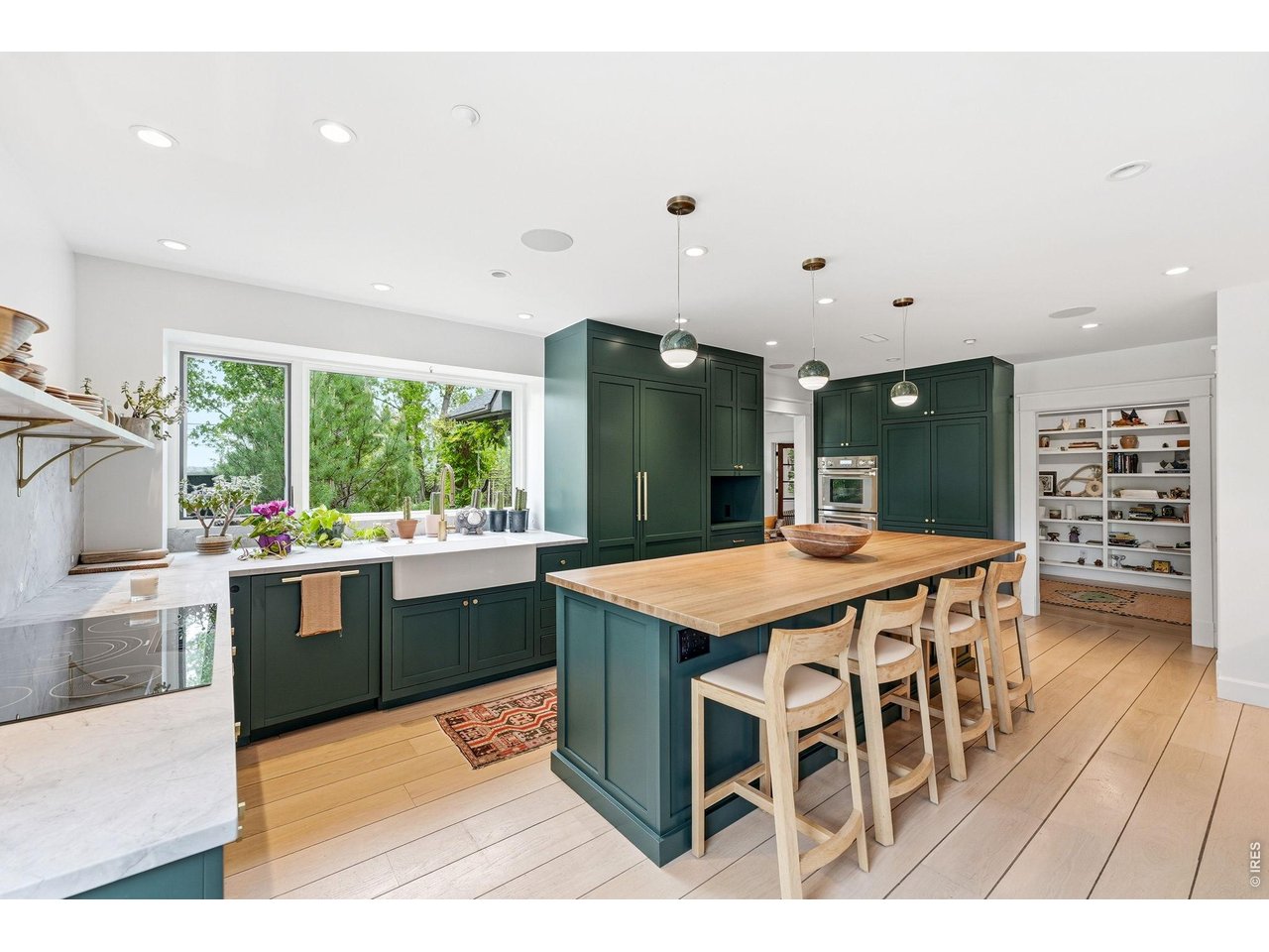 4795 Jay Road Boulder, CO 80301 - Photo 5 of 50 Induction stove, built-in fridge and dishwasher plus dish drawer and 2 fridge drawers, espresso station, 2 sinks, 2 ovens, butcher block counter top island bar, lots of cabinet space, breakfast nook, marble tops and backsplash.