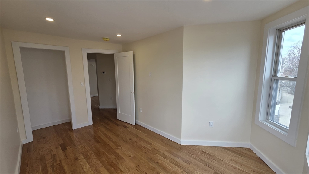 125 Central Avenue, Unit 3 Chelsea, MA 02150 - Photo 4 of 13 a view of hallway with a window and wooden floor