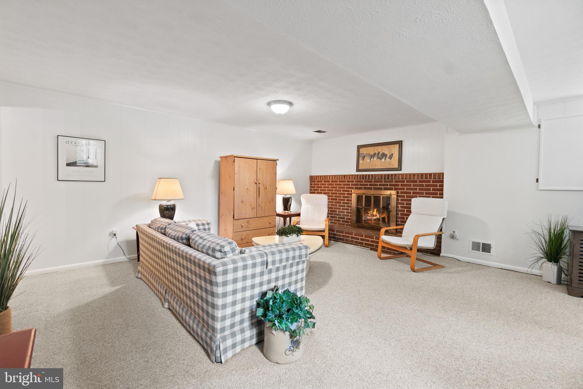 206 Rolling Road Gaithersburg, MD 20877 - Photo 30 of 51 So inviting w/brick fireplace & hearth