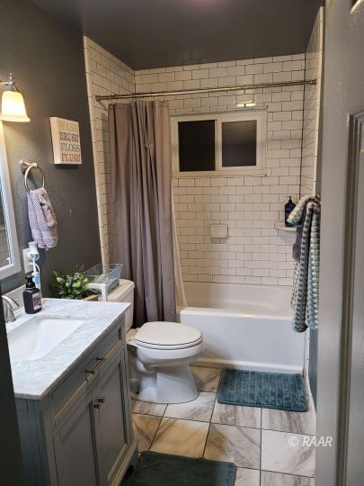 120 South Fire Opal Street Ridgecrest, CA 93555 - Photo 11 of 17 a bathroom with a sink and a mirror