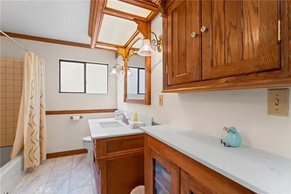 a view of cabinets and wooden floor
