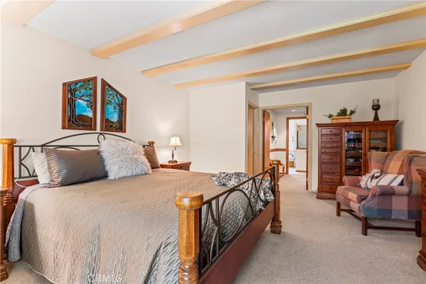 a spacious bedroom with a bed and furniture