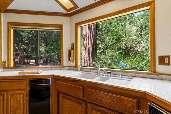 a view of a sink and a large window