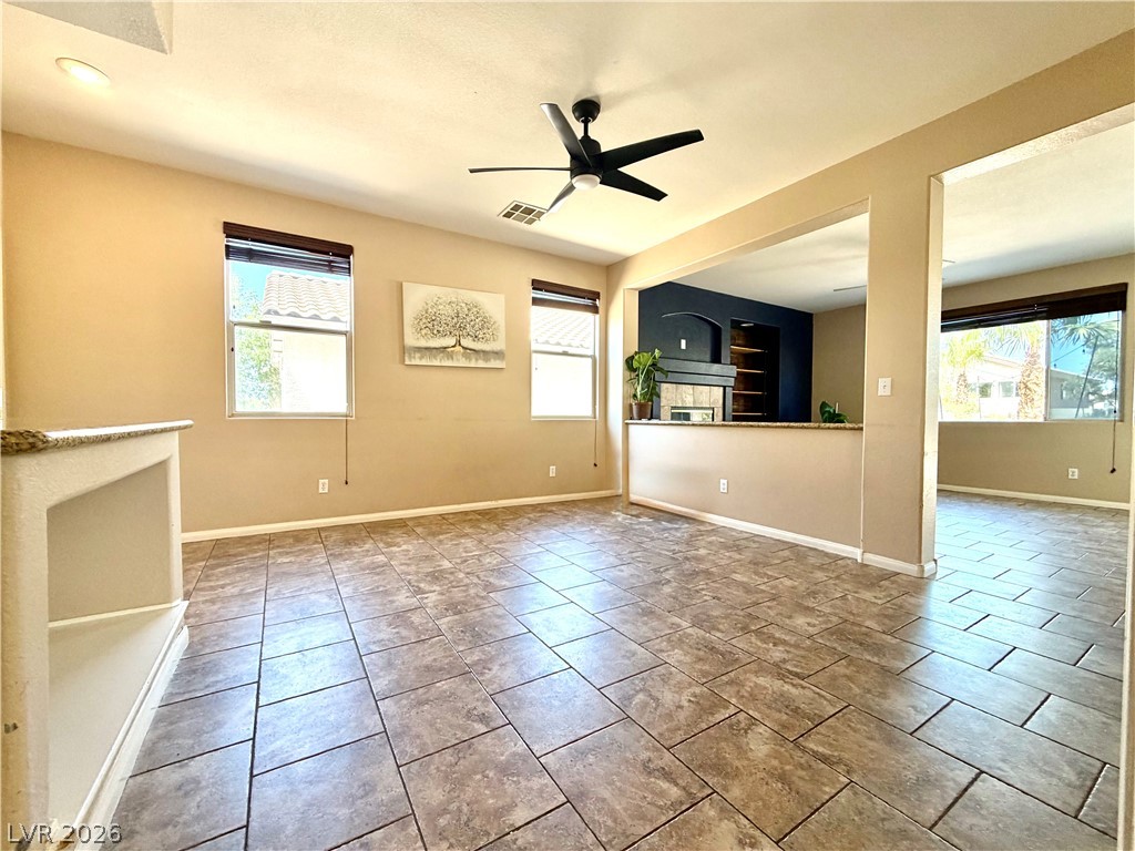 3936 Gold Point Street Las Vegas, NV 89129 - Photo 23 of 23 An open floorplan with tiled floors creates a versatile space for everyday living.