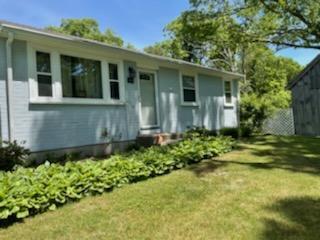55 Clay Pond Road Monument Beach, MA 02532 - Photo 15 of 15 a front view of a house with a yard
