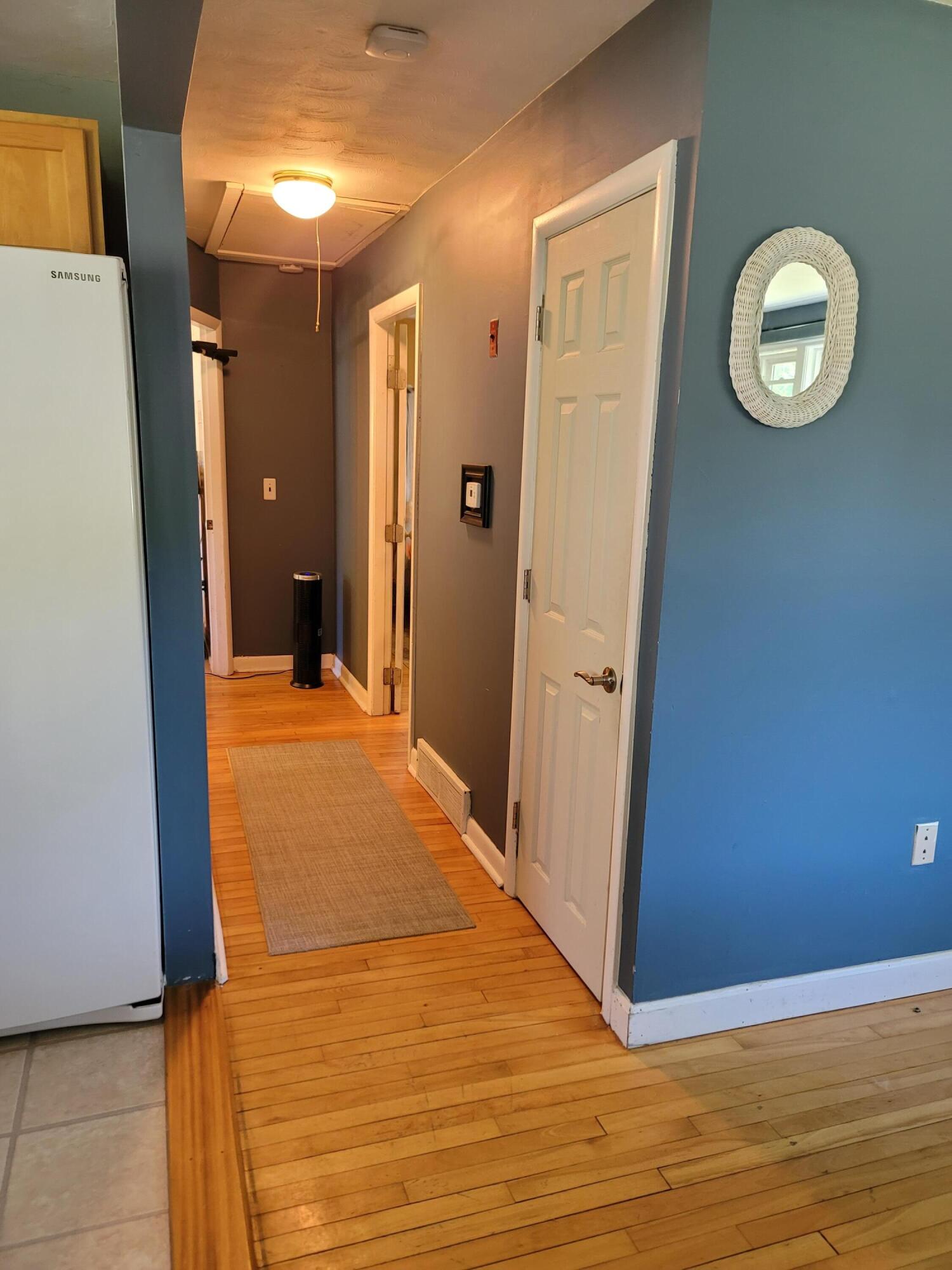 55 Clay Pond Road Monument Beach, MA 02532 - Photo 6 of 15 a view of a hallway with wooden floor