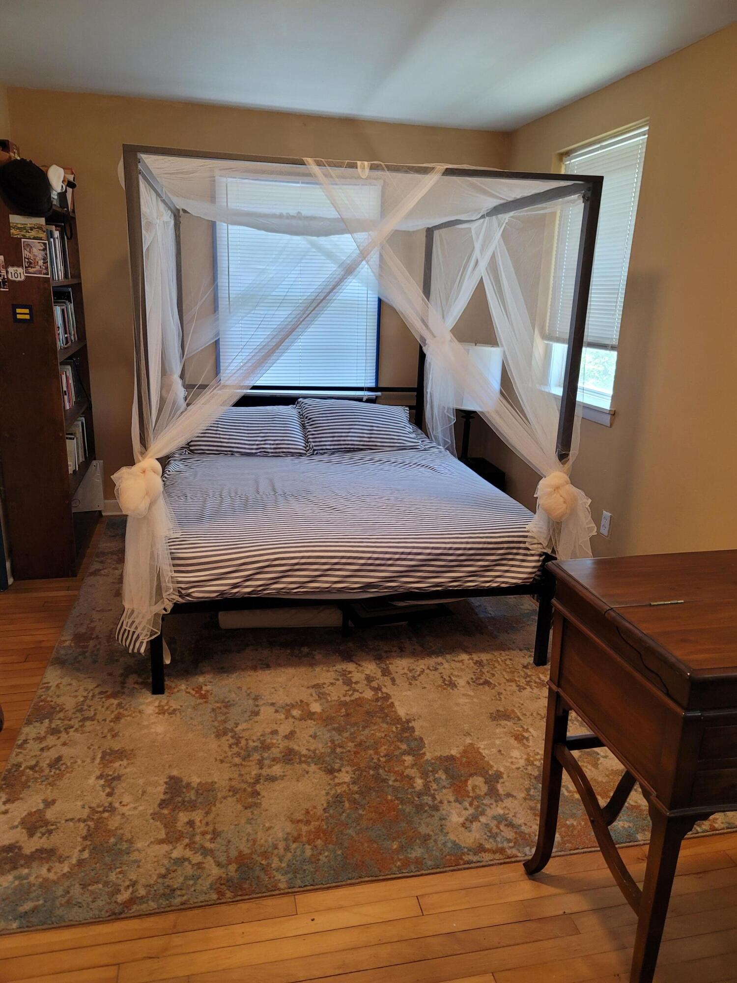 55 Clay Pond Road Monument Beach, MA 02532 - Photo 7 of 15 a bedroom with a bed and a window