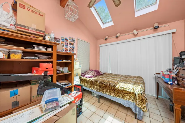 a bedroom with a bed and a closet