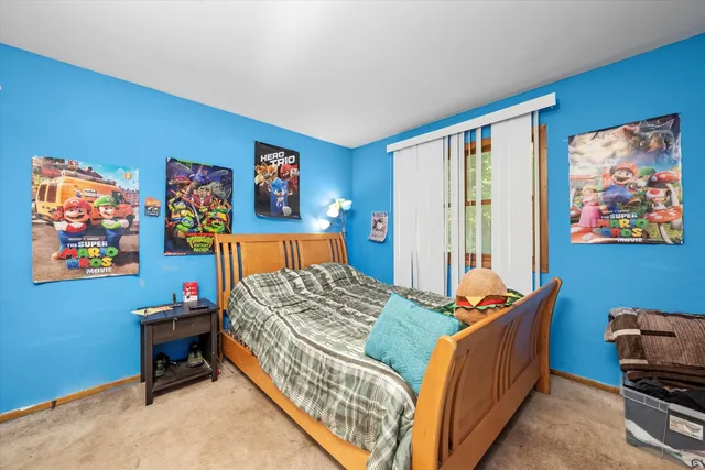 a bed room with a bed and a window