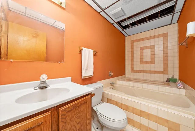 a bathroom with a sink and toilet