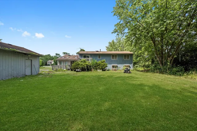 a view of a house with a back yard