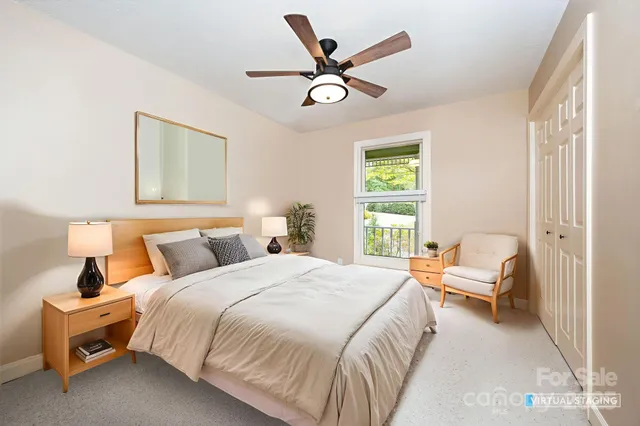 a bedroom with a bed and window