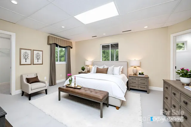 a bedroom with furniture and a potted plant