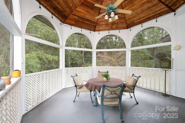 a view of a dining room with furniture window and outside view