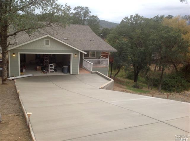 18967 Moon Ridge Road Hidden Valley Lake, CA 95467 - Photo 1 of 1 an outdoor view of house and garage