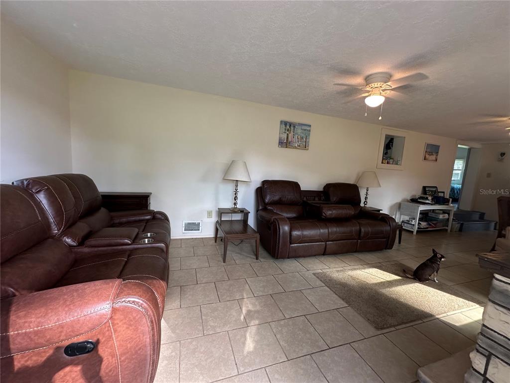 55045 6th Street Astor, FL 32102 - Photo 16 of 38 a living room with furniture