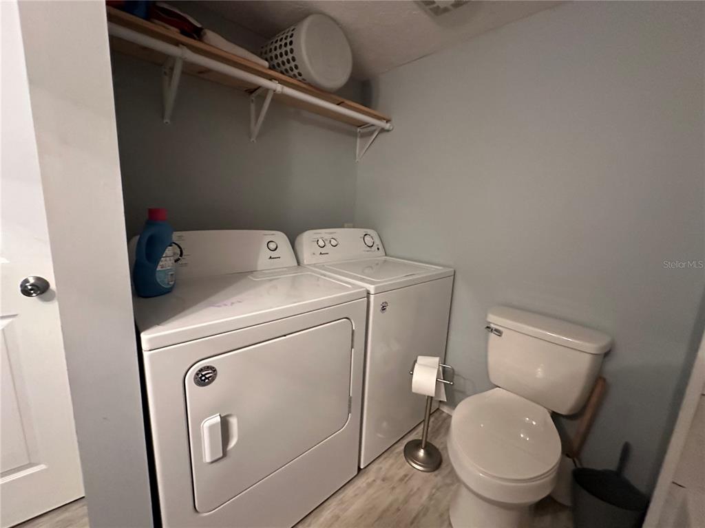 55045 6th Street Astor, FL 32102 - Photo 22 of 38 a utility room with dryer and washer