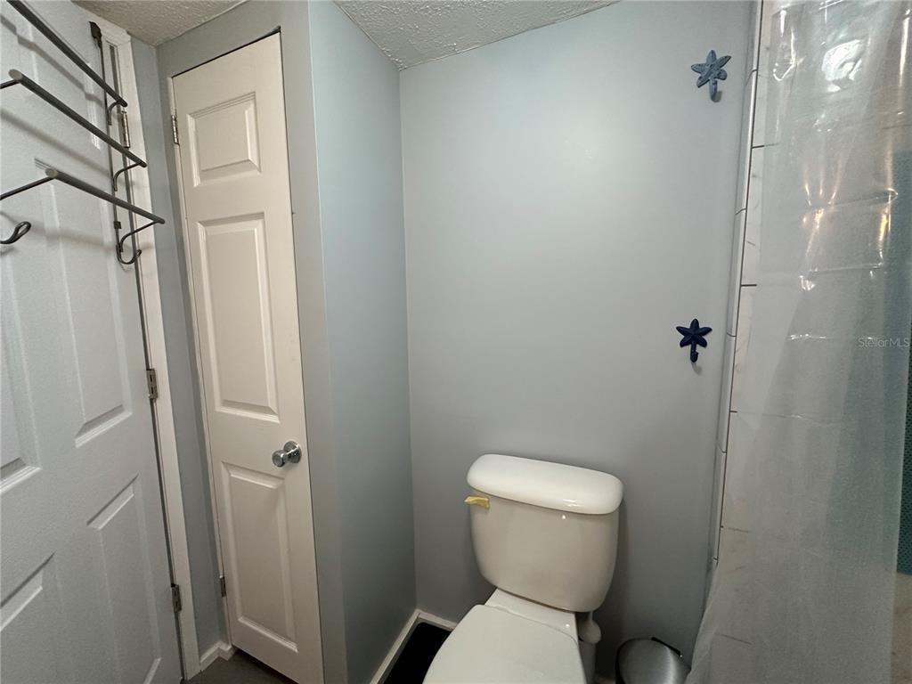 55045 6th Street Astor, FL 32102 - Photo 24 of 38 a bathroom with a toilet and a shower
