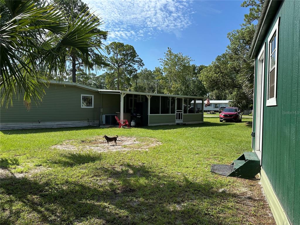 55045 6th Street Astor, FL 32102 - Photo 31 of 38 a view of outdoor space yard and swimming pool