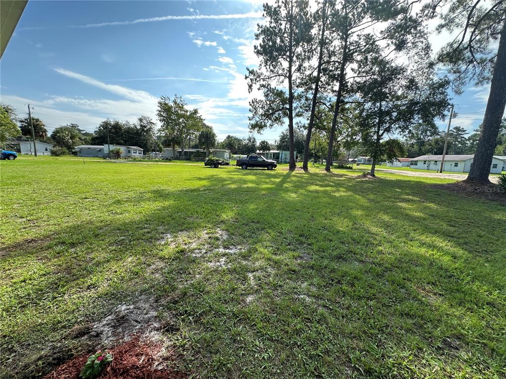 55045 6th Street Astor, FL 32102 - Photo 33 of 38 a view of field with trees in the background