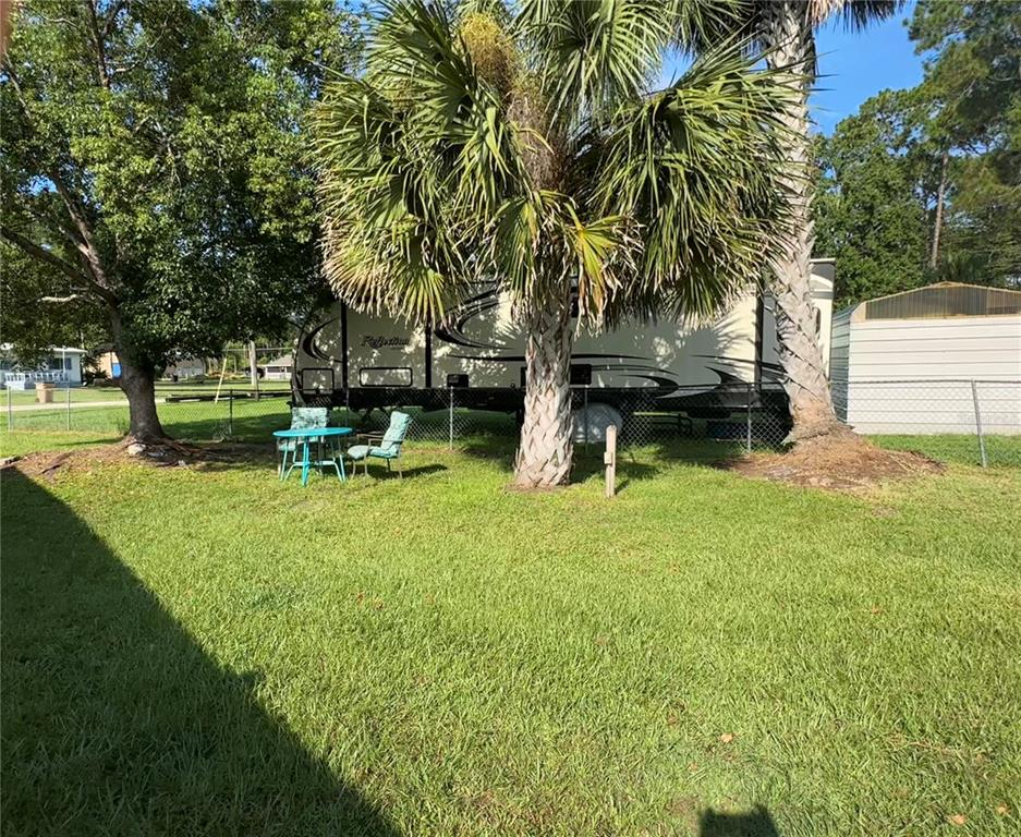 55045 6th Street Astor, FL 32102 - Photo 34 of 38 a view of a park with large trees