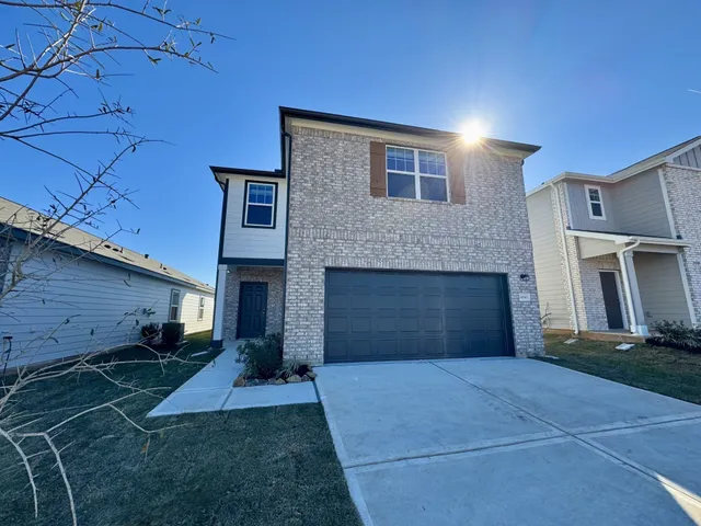 a front view of a house with yard