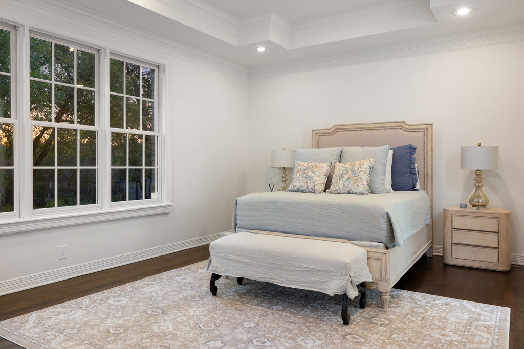 1350 Patterson Road Austin, TX 78733 - Photo 15 of 40 a bedroom with a bed and a window