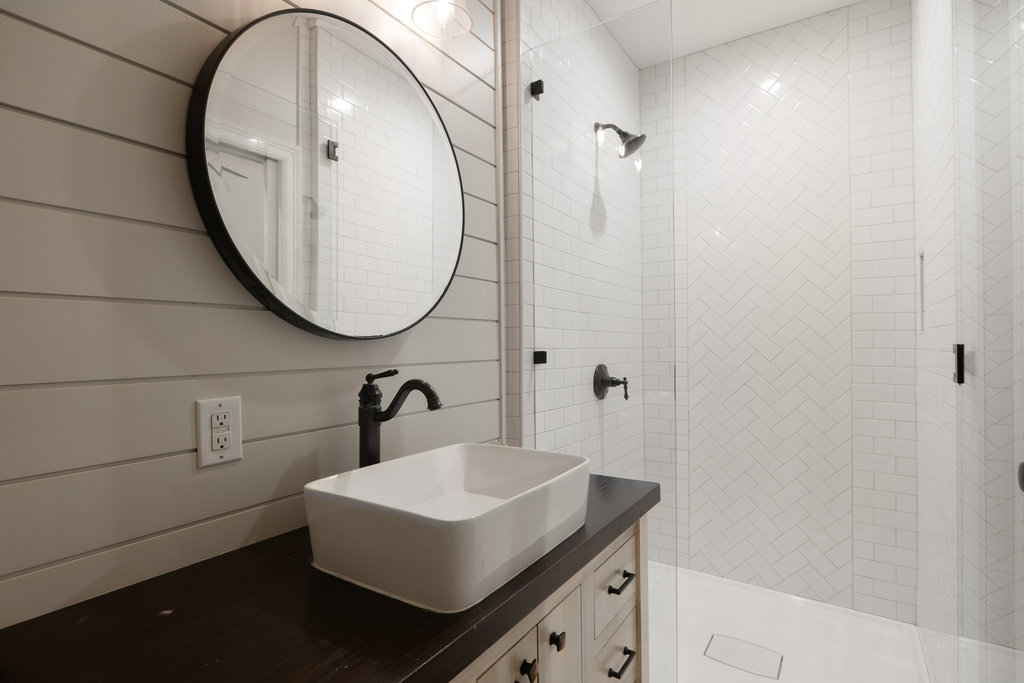 1350 Patterson Road Austin, TX 78733 - Photo 20 of 40 a bathroom with a sink and a mirror