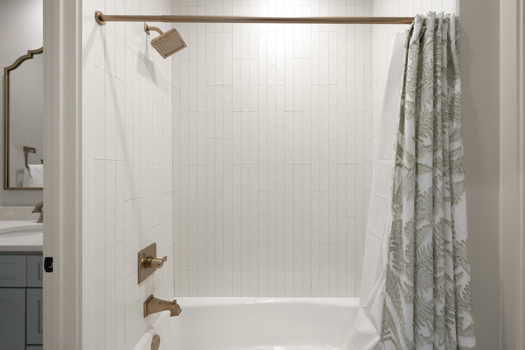 1350 Patterson Road Austin, TX 78733 - Photo 23 of 40 a bathroom with a shower and a curtain