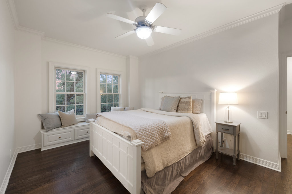 1350 Patterson Road Austin, TX 78733 - Photo 25 of 40 a bedroom with a bed and a large window