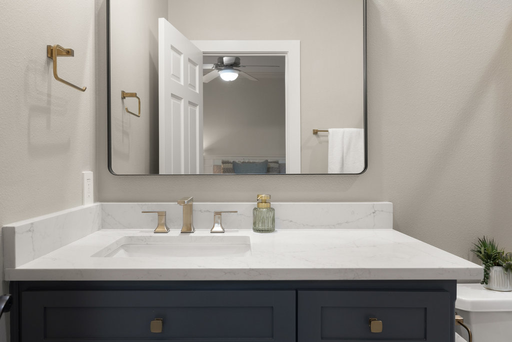 1350 Patterson Road Austin, TX 78733 - Photo 26 of 40 a bathroom with a sink and a mirror