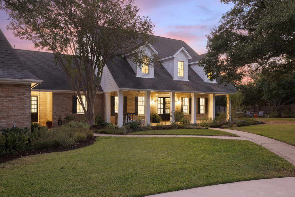 1350 Patterson Road Austin, TX 78733 - Photo 3 of 40 a front view of a house with a yard