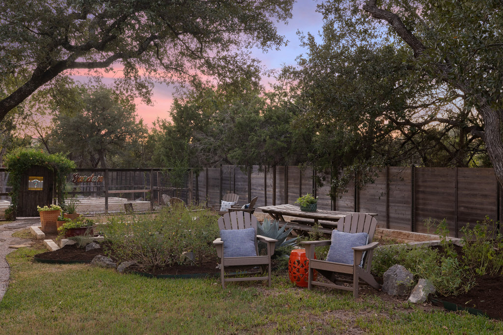 1350 Patterson Road Austin, TX 78733 - Photo 38 of 40 a backyard of a house with lots of green space
