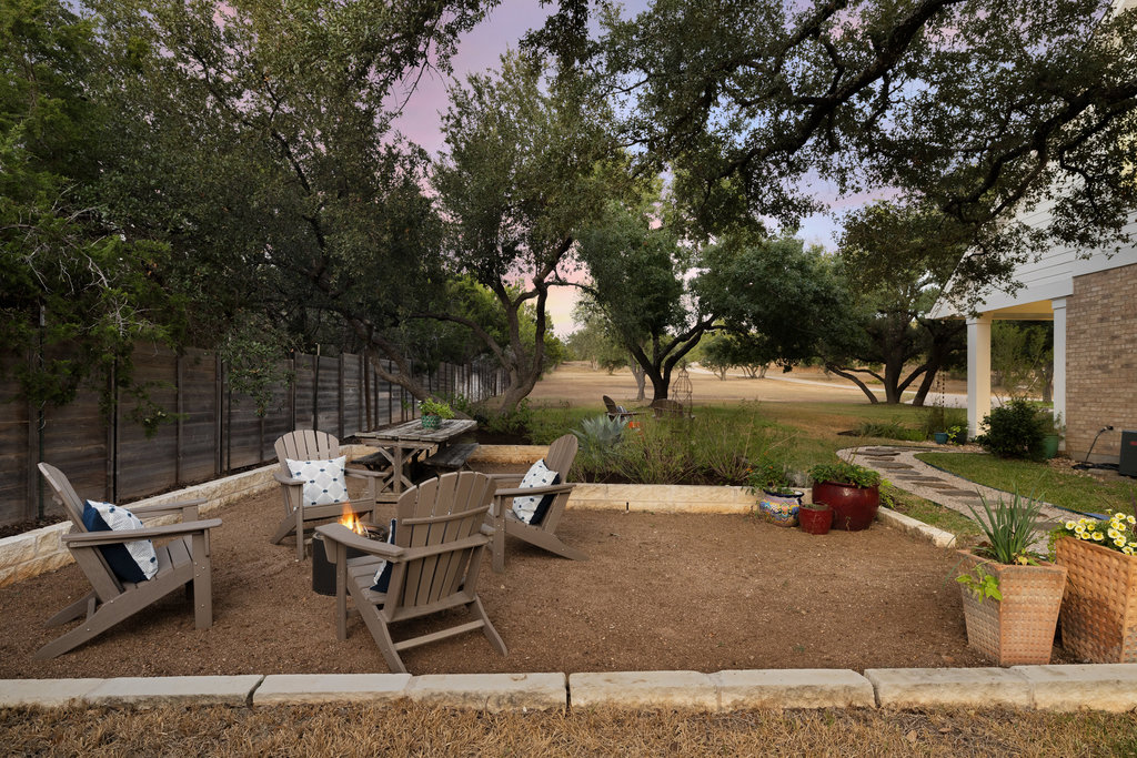 1350 Patterson Road Austin, TX 78733 - Photo 39 of 40 a backyard of a house with table and chairs
