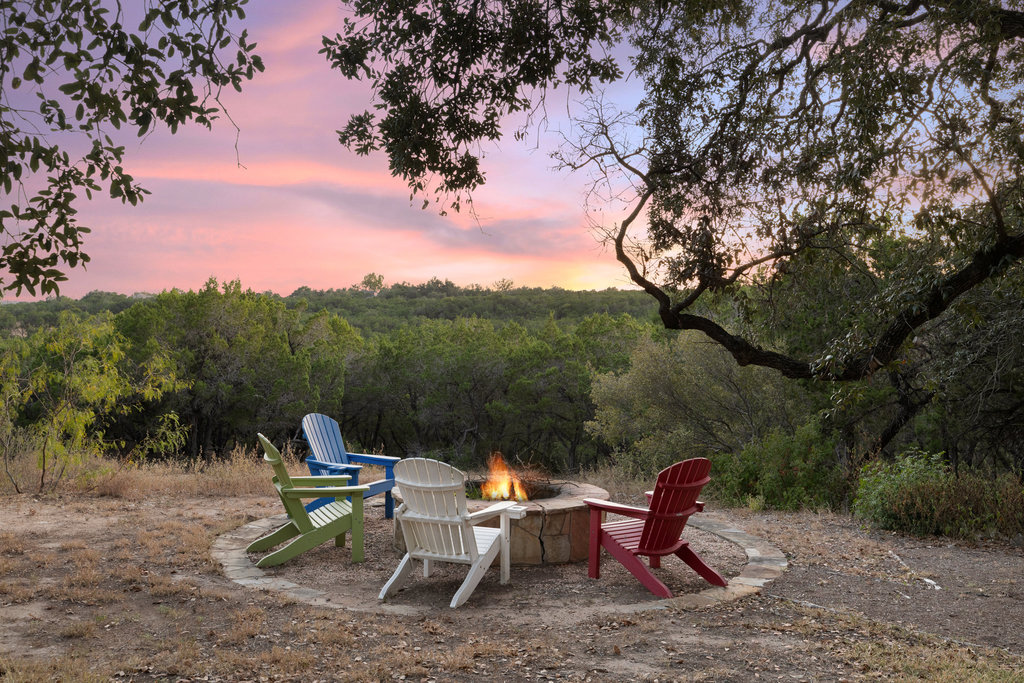 1350 Patterson Road Austin, TX 78733 - Photo 40 of 40 a backyard of a house with table and chairs