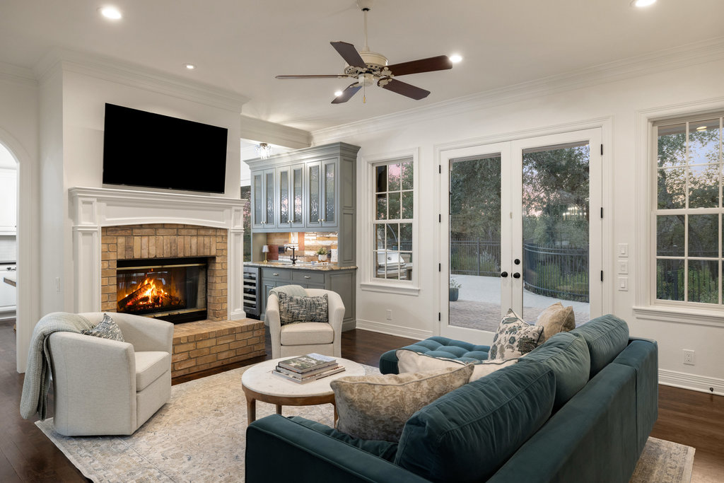 1350 Patterson Road Austin, TX 78733 - Photo 7 of 40 a living room with furniture fireplace and a flat screen tv