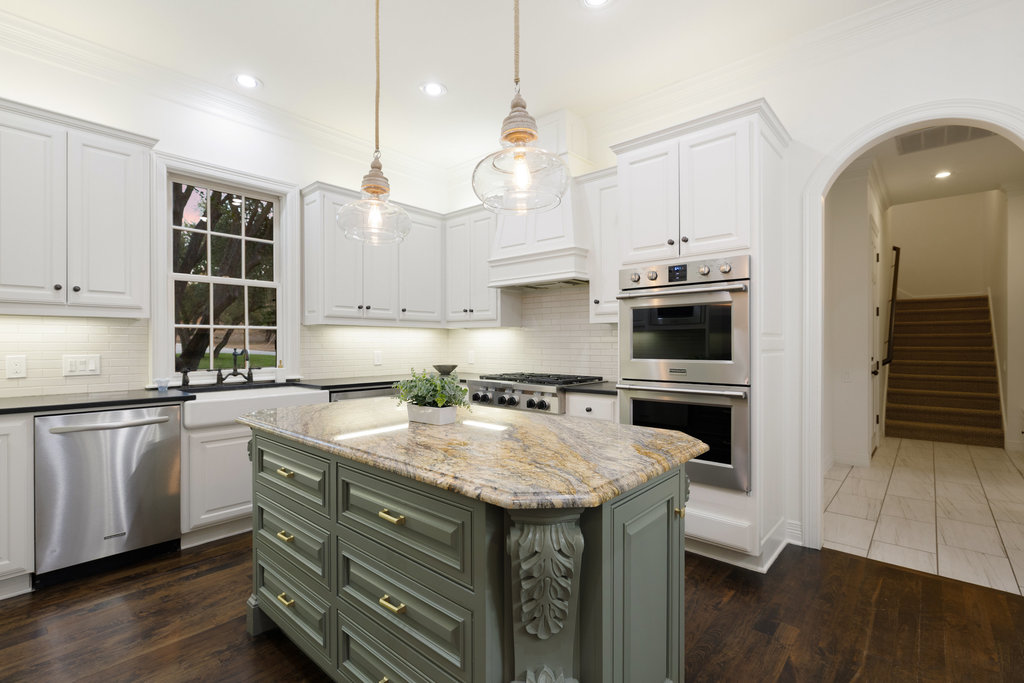 1350 Patterson Road Austin, TX 78733 - Photo 9 of 40 a kitchen with a sink a stove and cabinets