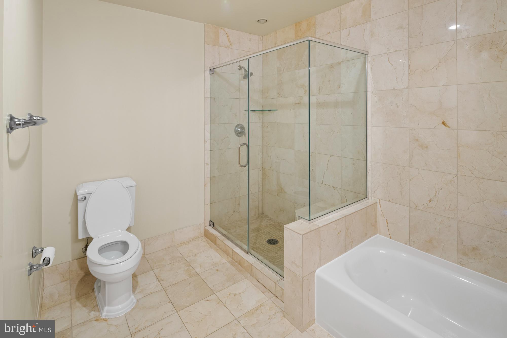 8220 Crestwood Heights Drive, Unit 1215 McLean, VA 22102 - Photo 18 of 59 a bathroom with a toilet and a shower